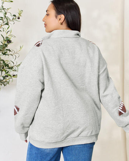 Double Take Full Size Sequin Football Half Zip Long Sleeve Sweatshirt