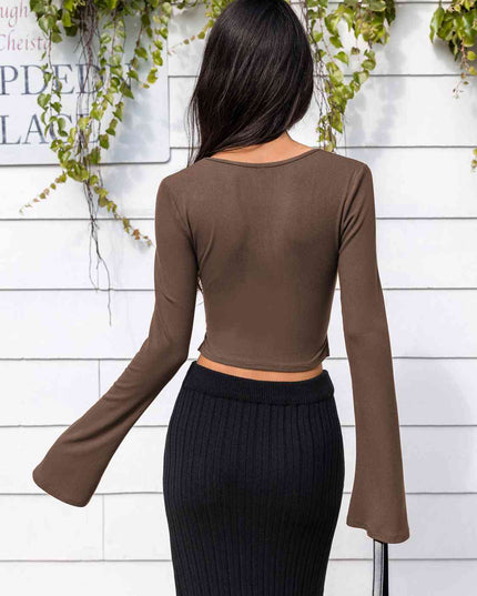 Lone Sleeve Cutout Zip Up Crop Top